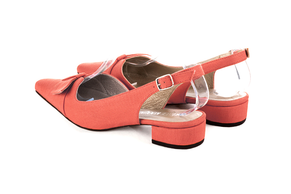 Women's coral slingback dress shoes, with a knot on the front. Tapered toe. Low block heels - Rear view